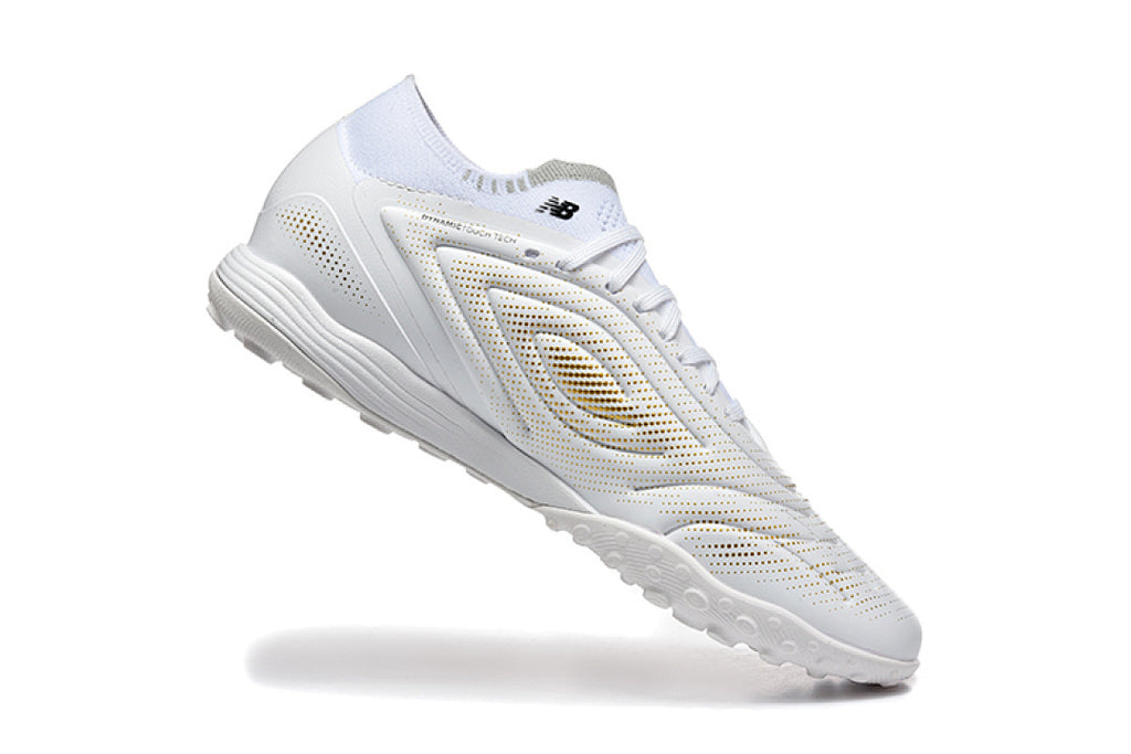 Chuteira New Balance Tekela Elite V5 Society