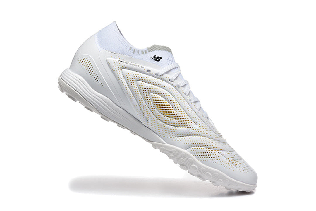 Chuteira New Balance Tekela Elite V5 Society