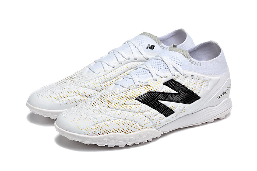 Chuteira New Balance Tekela Elite V5 Society